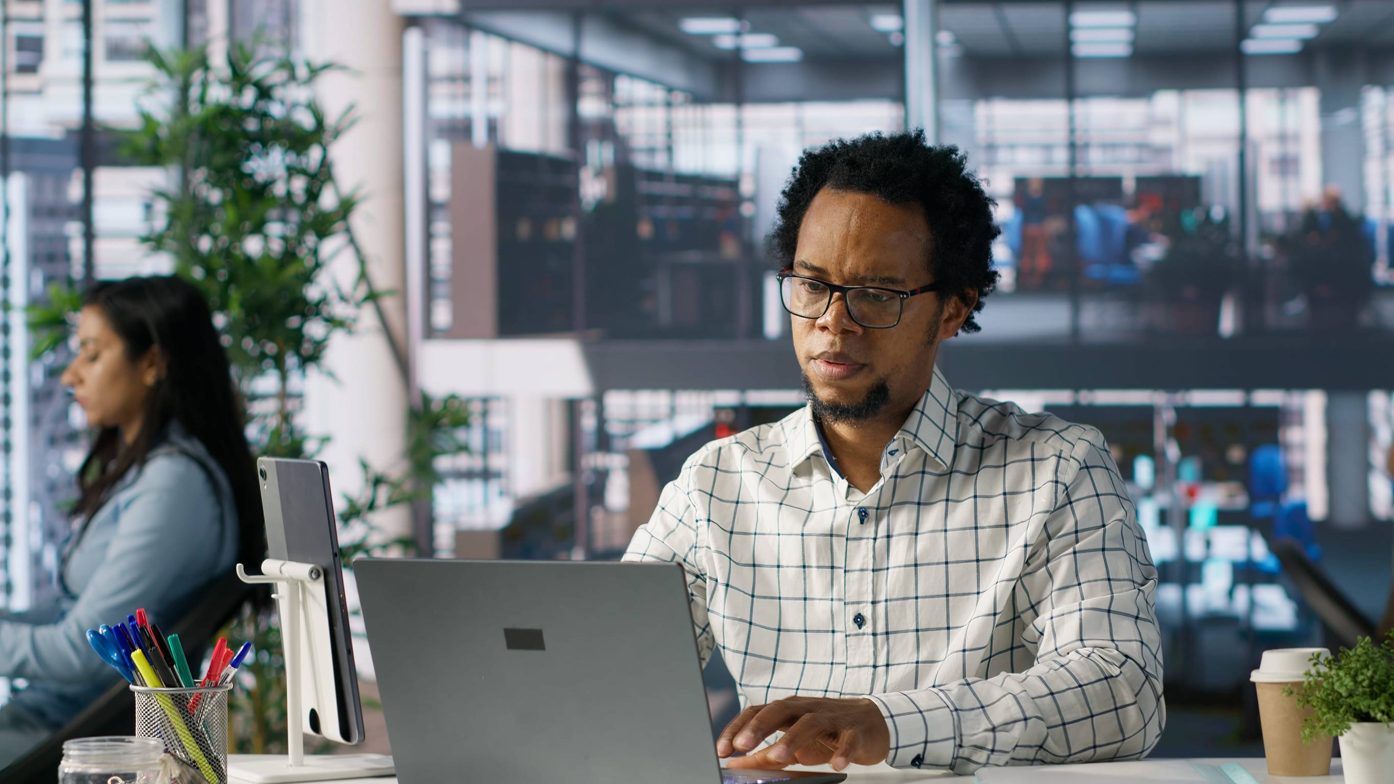 A Person Working On The Laptop