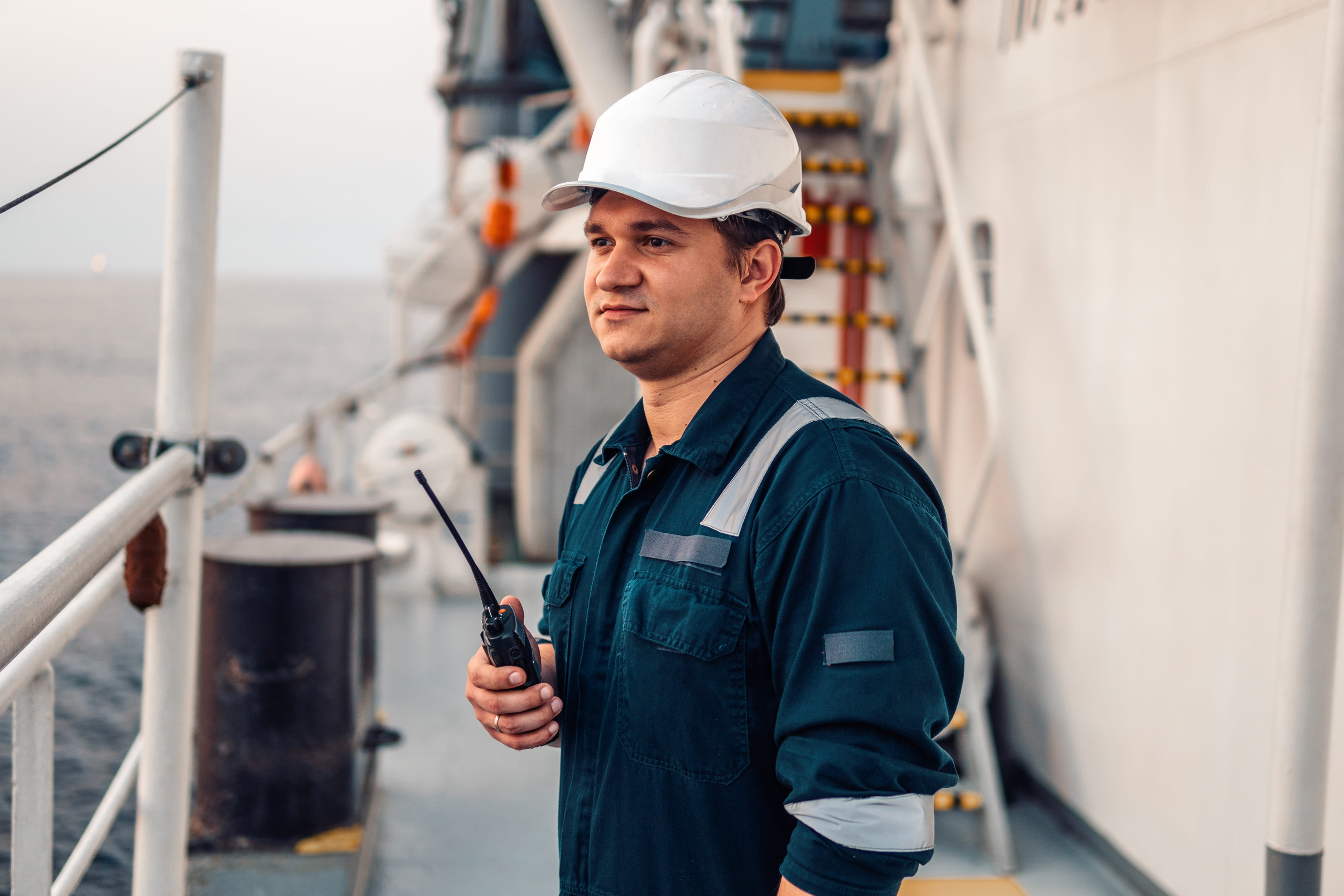 A seaman using a vockey talky
