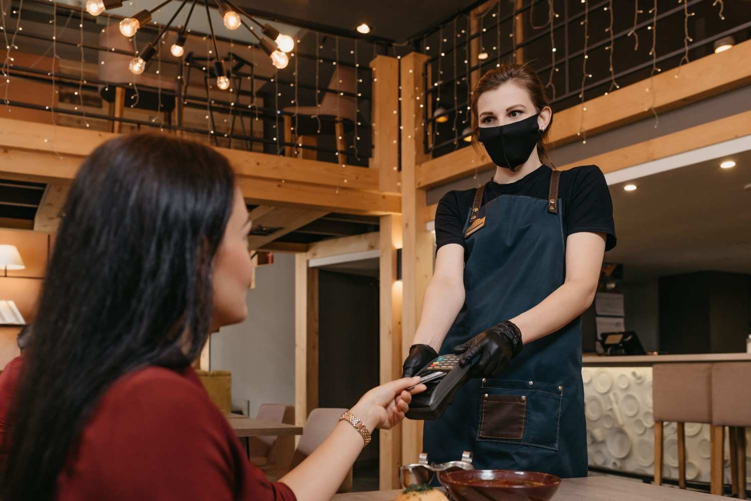 A Woman Tipping The Waitress
