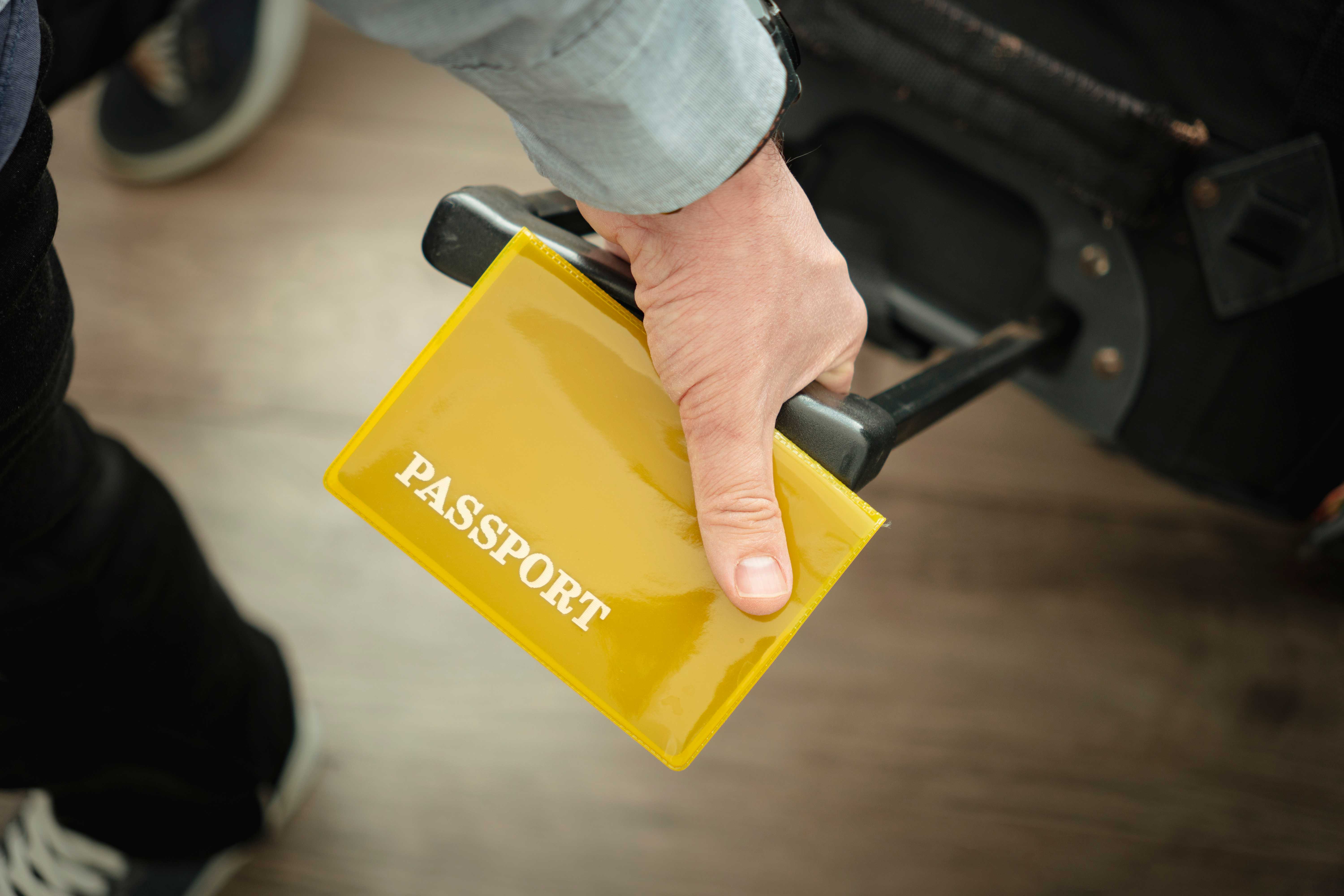 Airport Passport in Man Hand