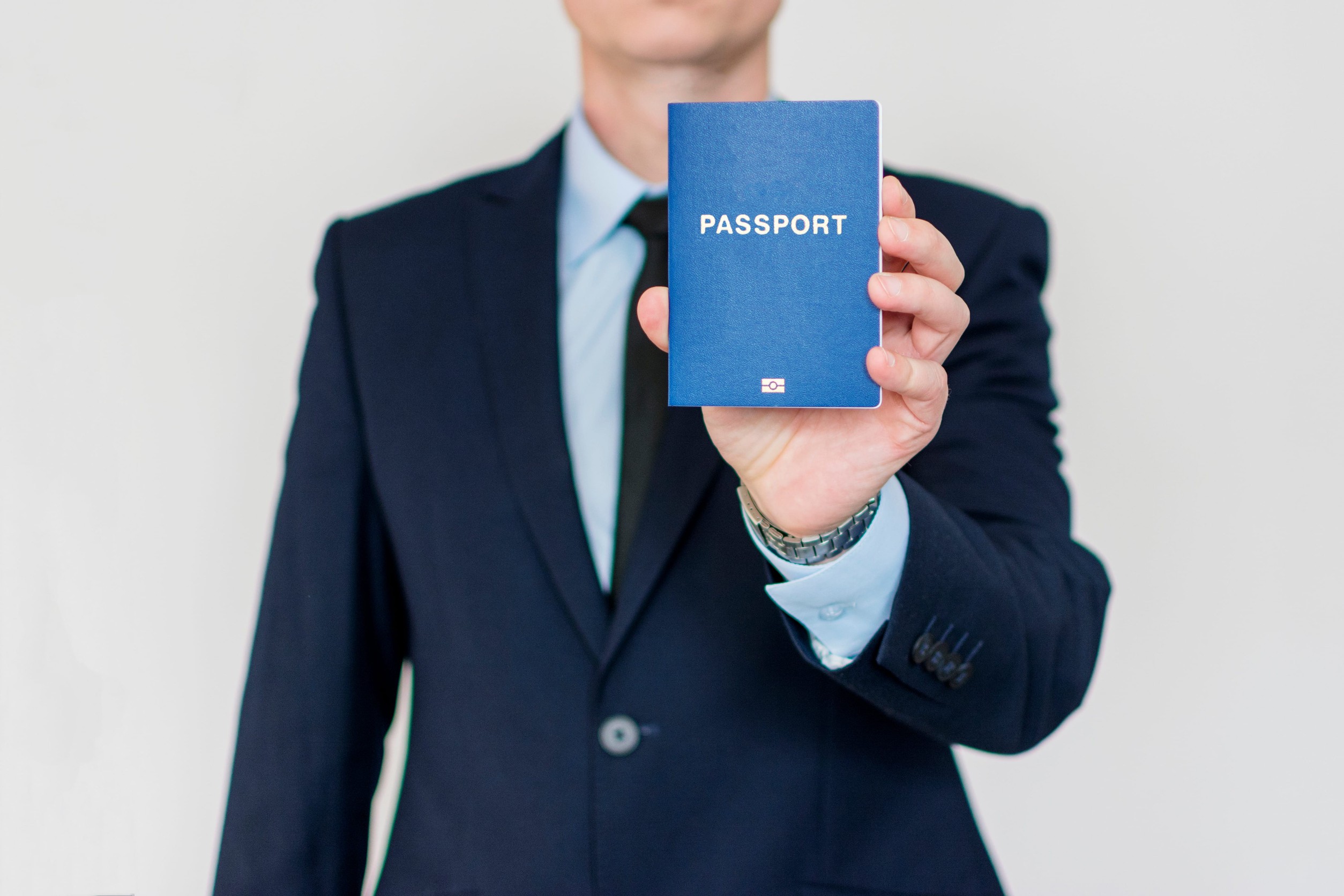 Business Man Holding Passport