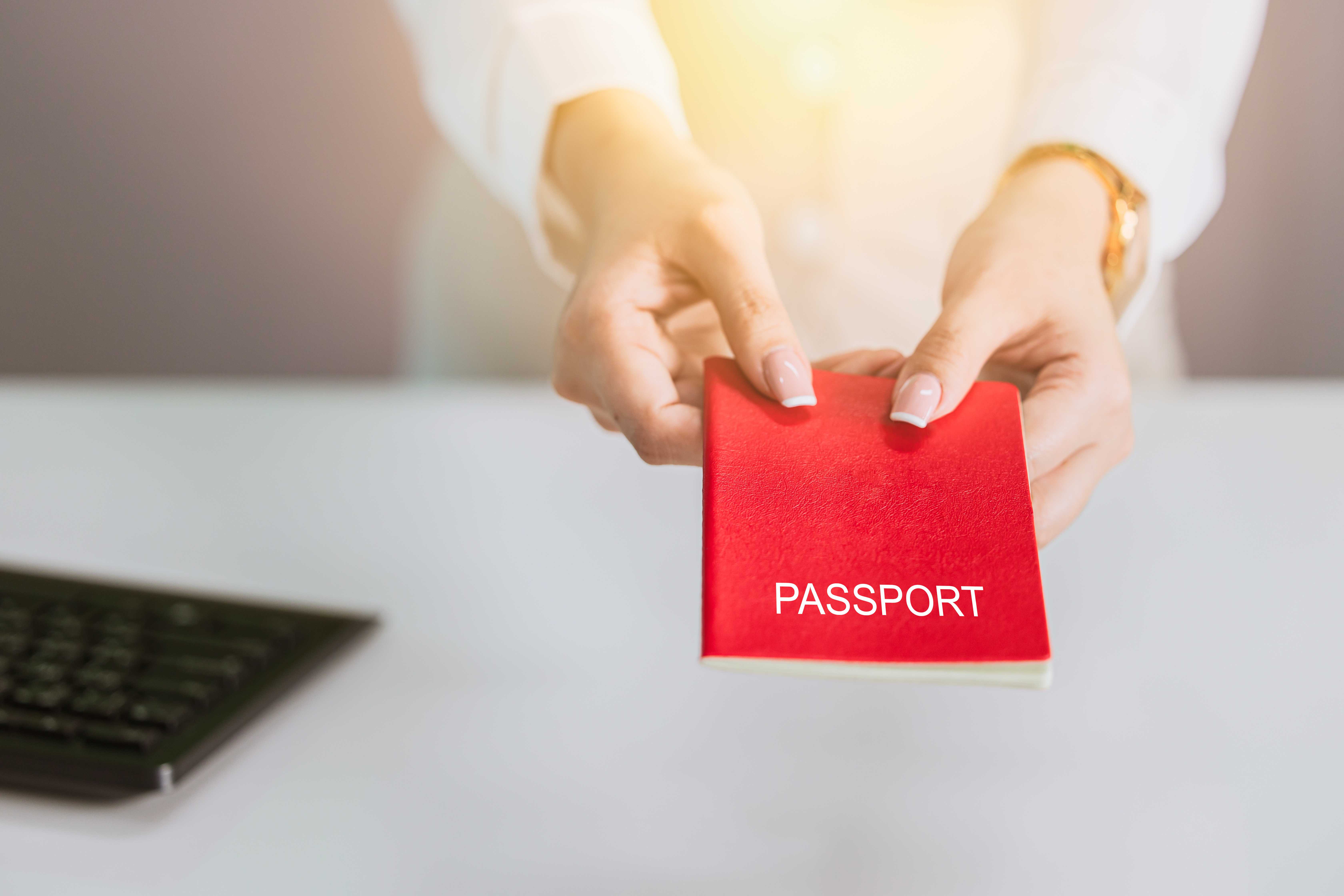 Closeup of hand holding passport