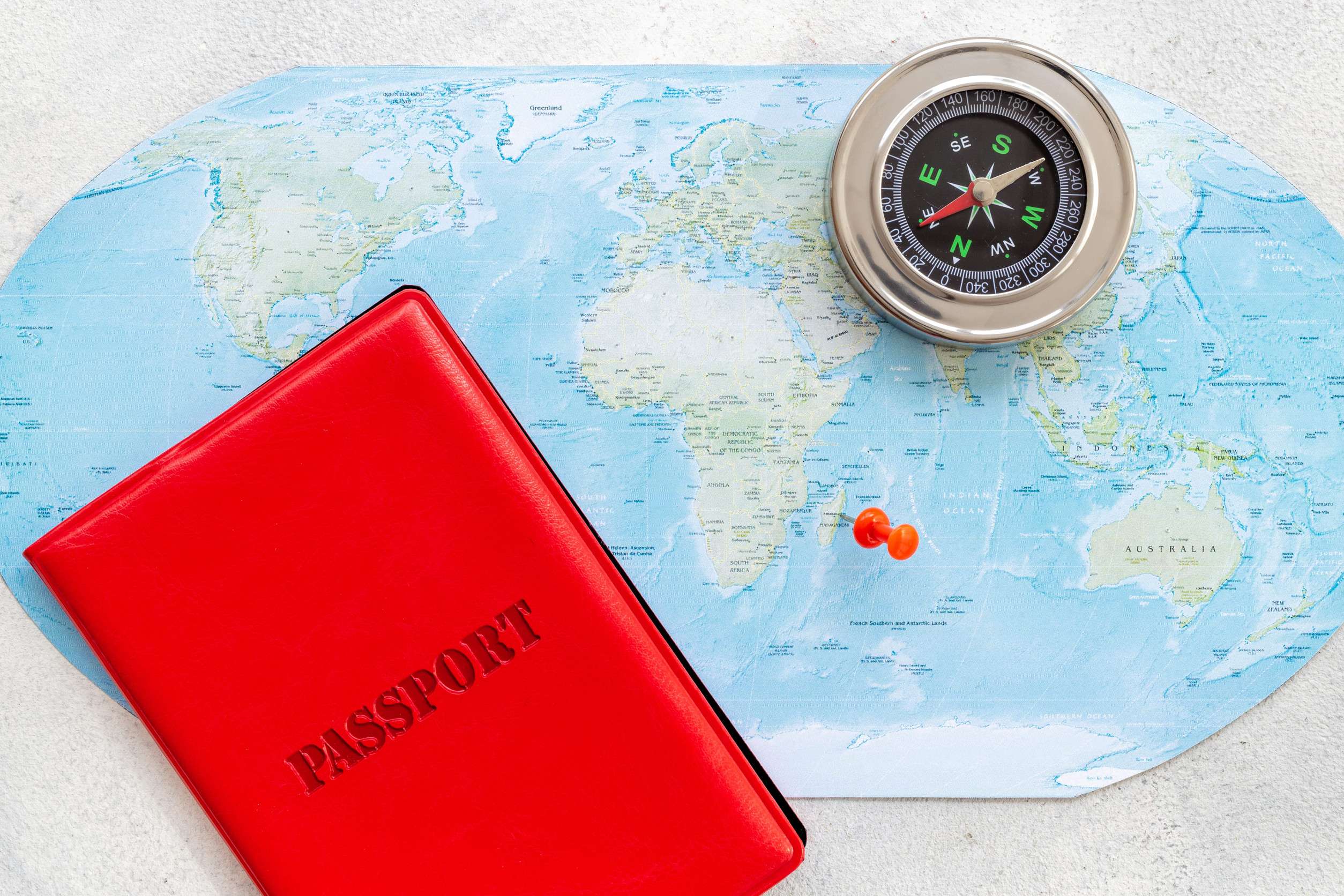 Compass And Passport On World Map