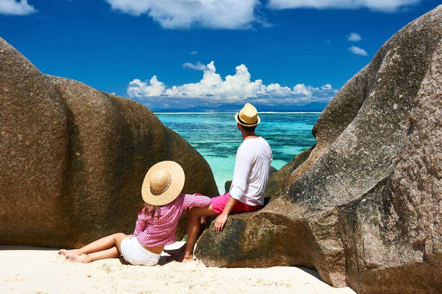 Couple Relaxing At Anse Source Dargent