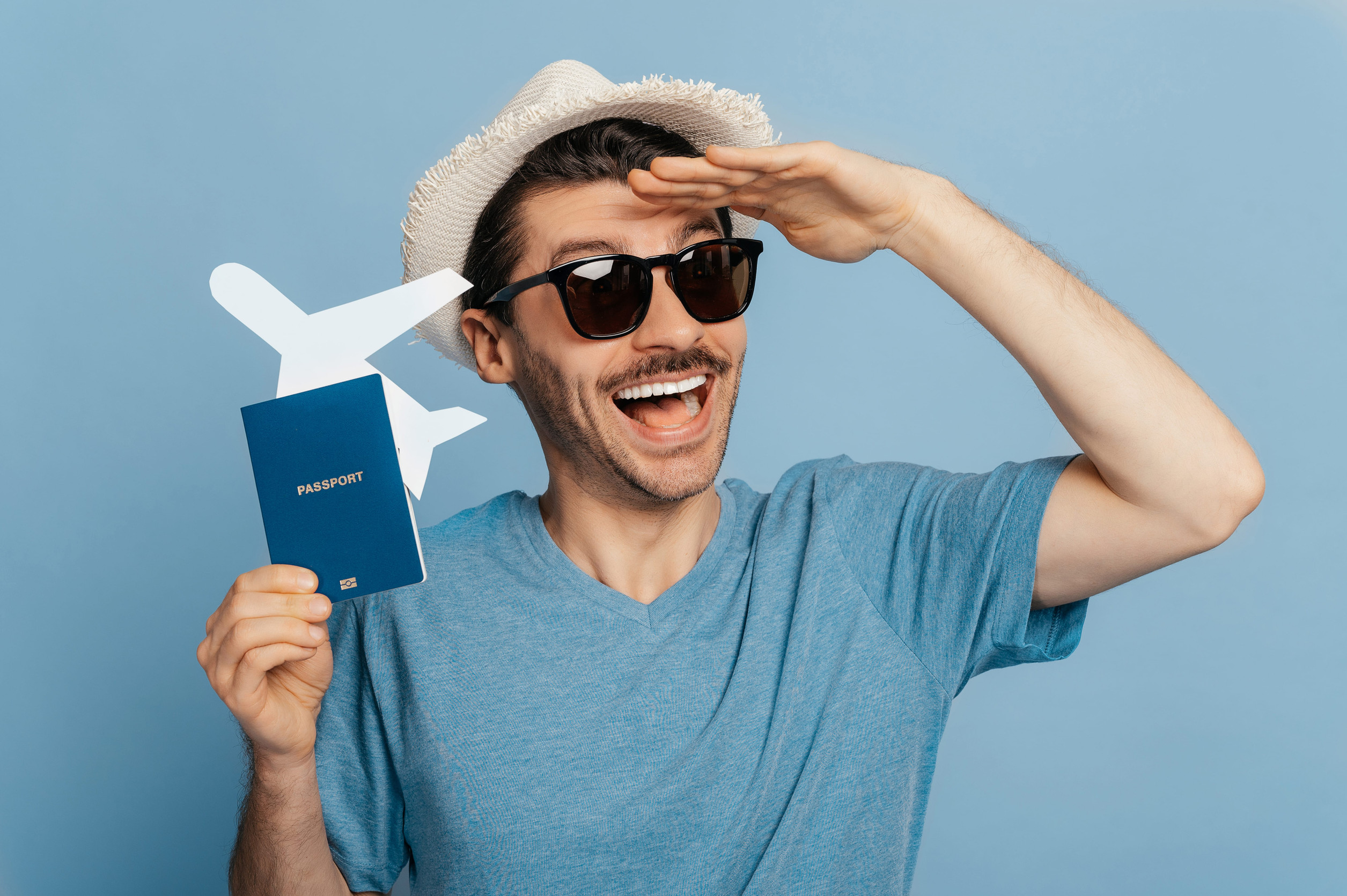 Man Holding Passport And Plane For Summer Travel