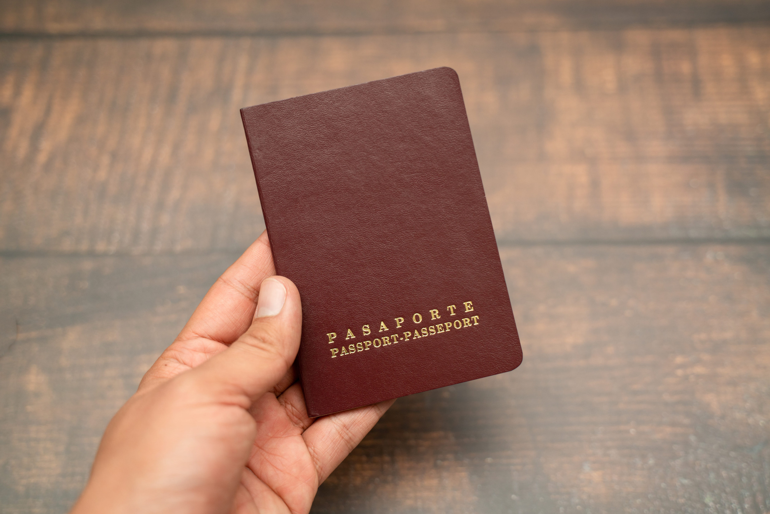 Man holds with his hand the Passport
