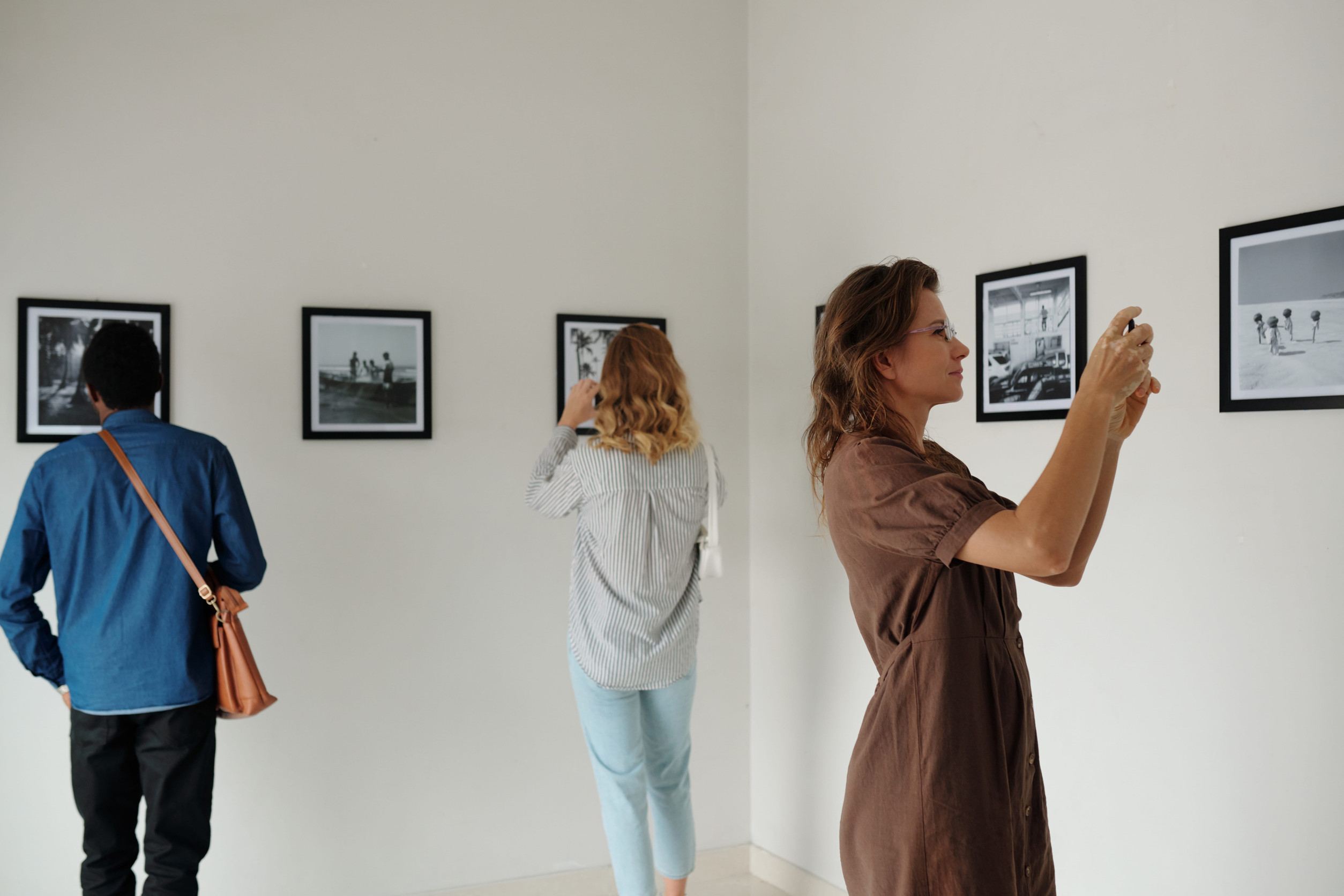 People Photographing Black And White Photos