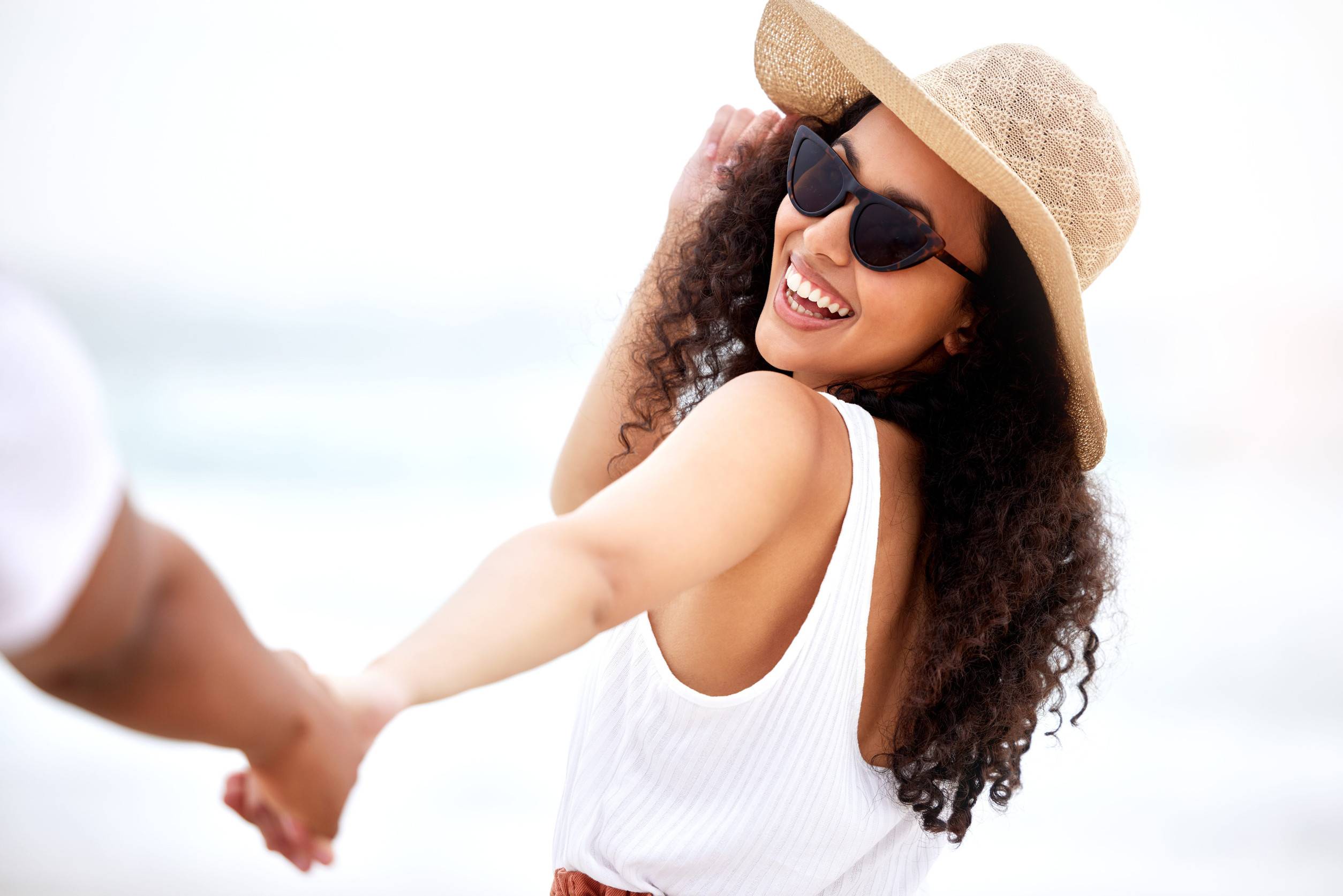 Smiling Woman Enjoying The Seychelles Coastline