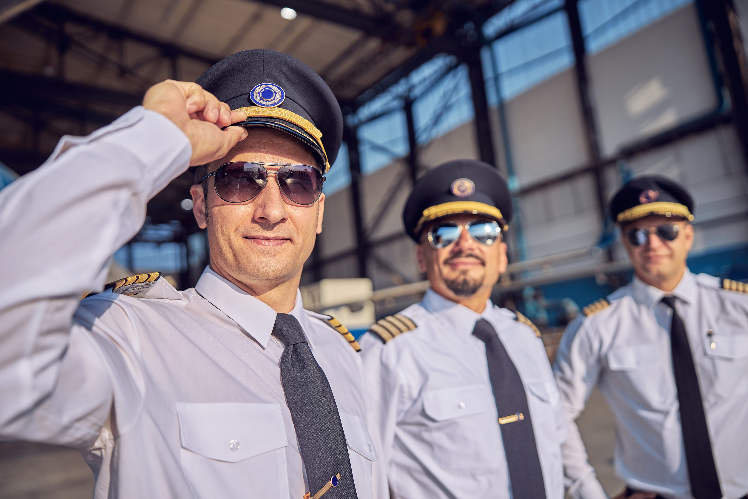 Three crew members wearing a uniform
