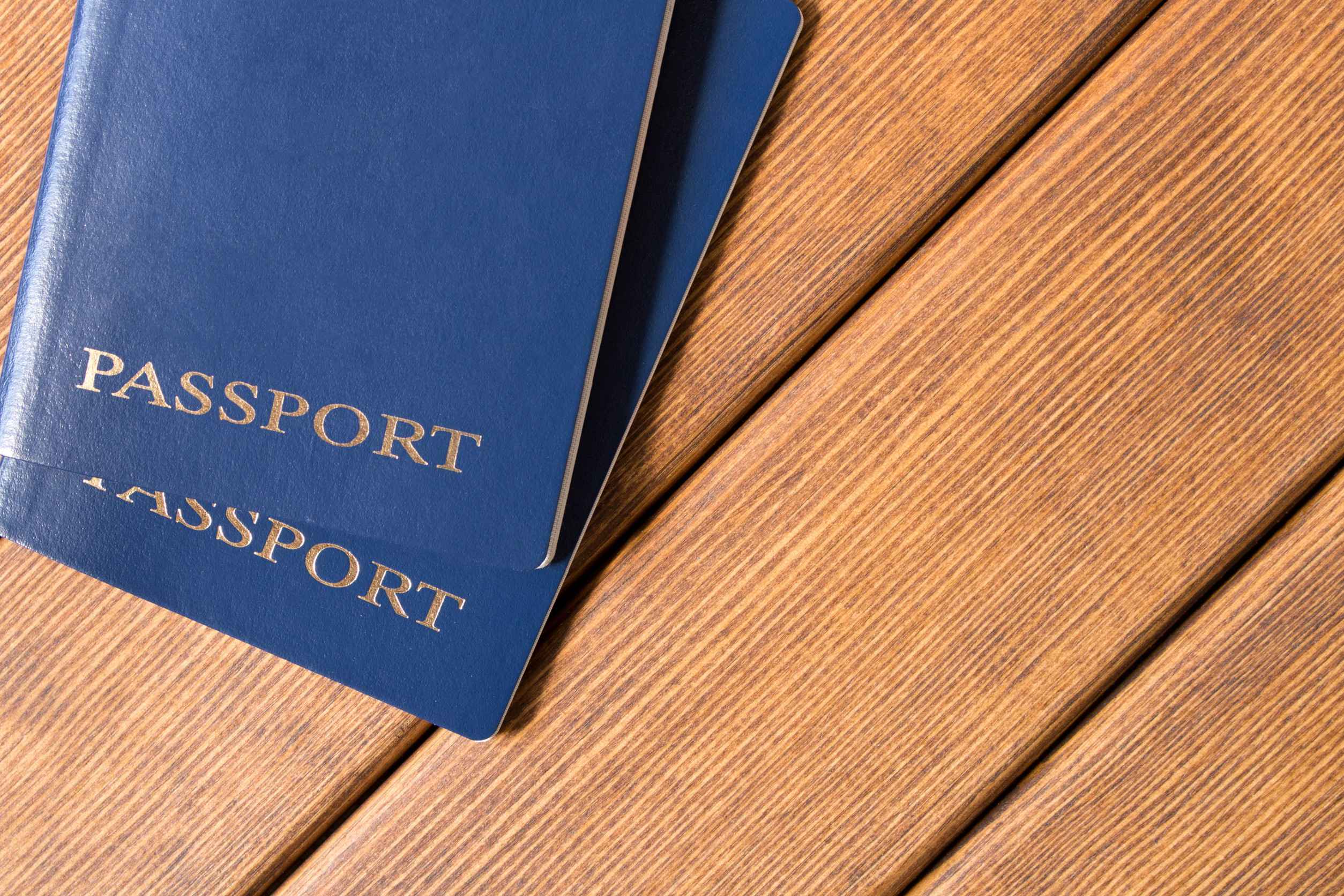 Two Passports on Wooden Table