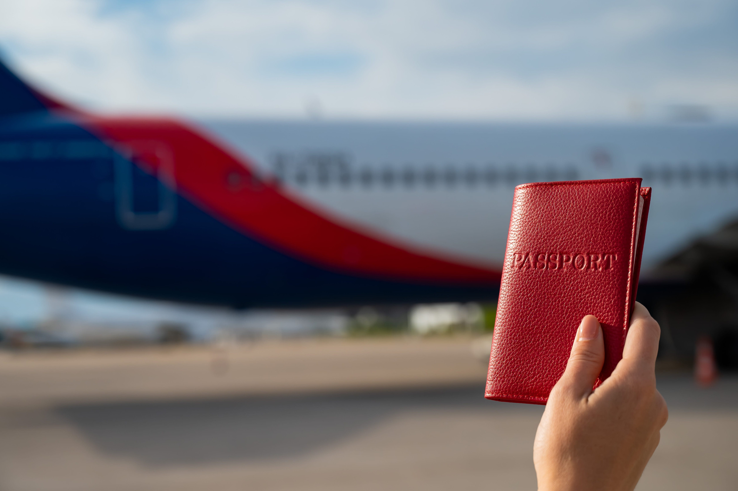 Woman Boarding Plane with Passport