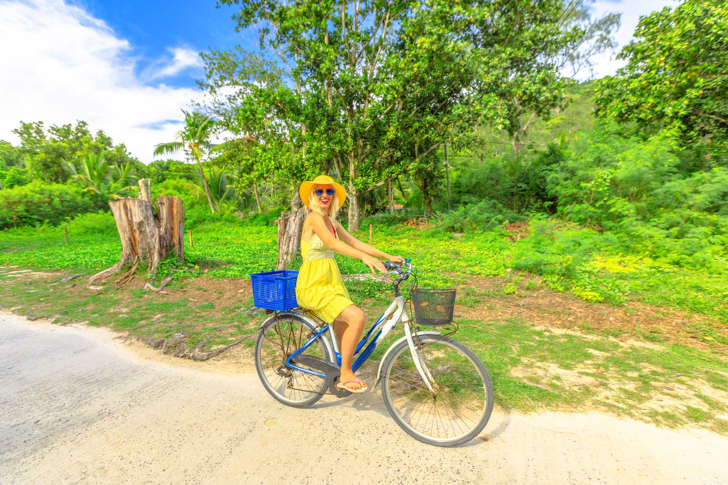 Woman Cycling On La Digue Island