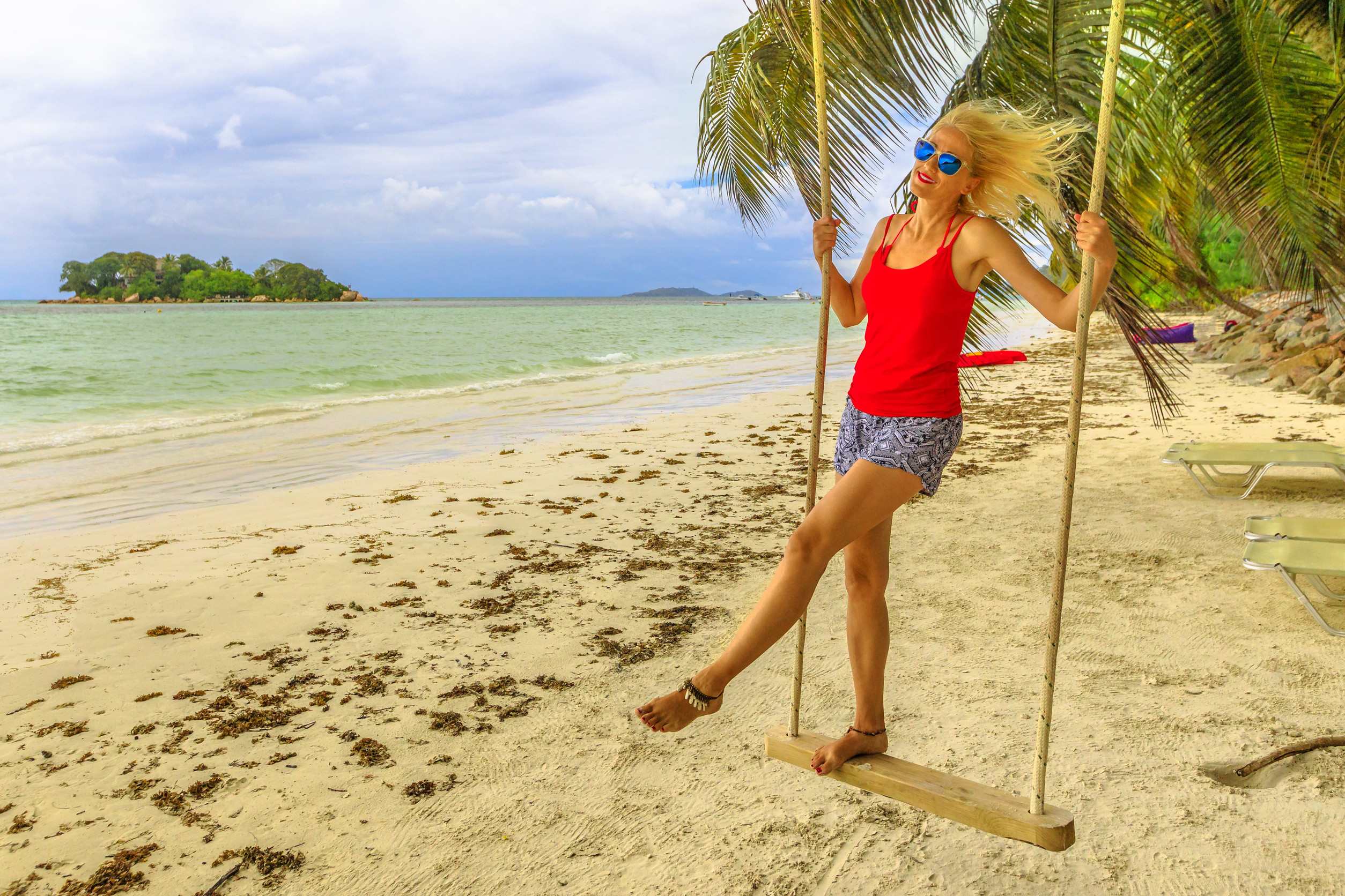 Woman Swinging At Anse Volbert Beach