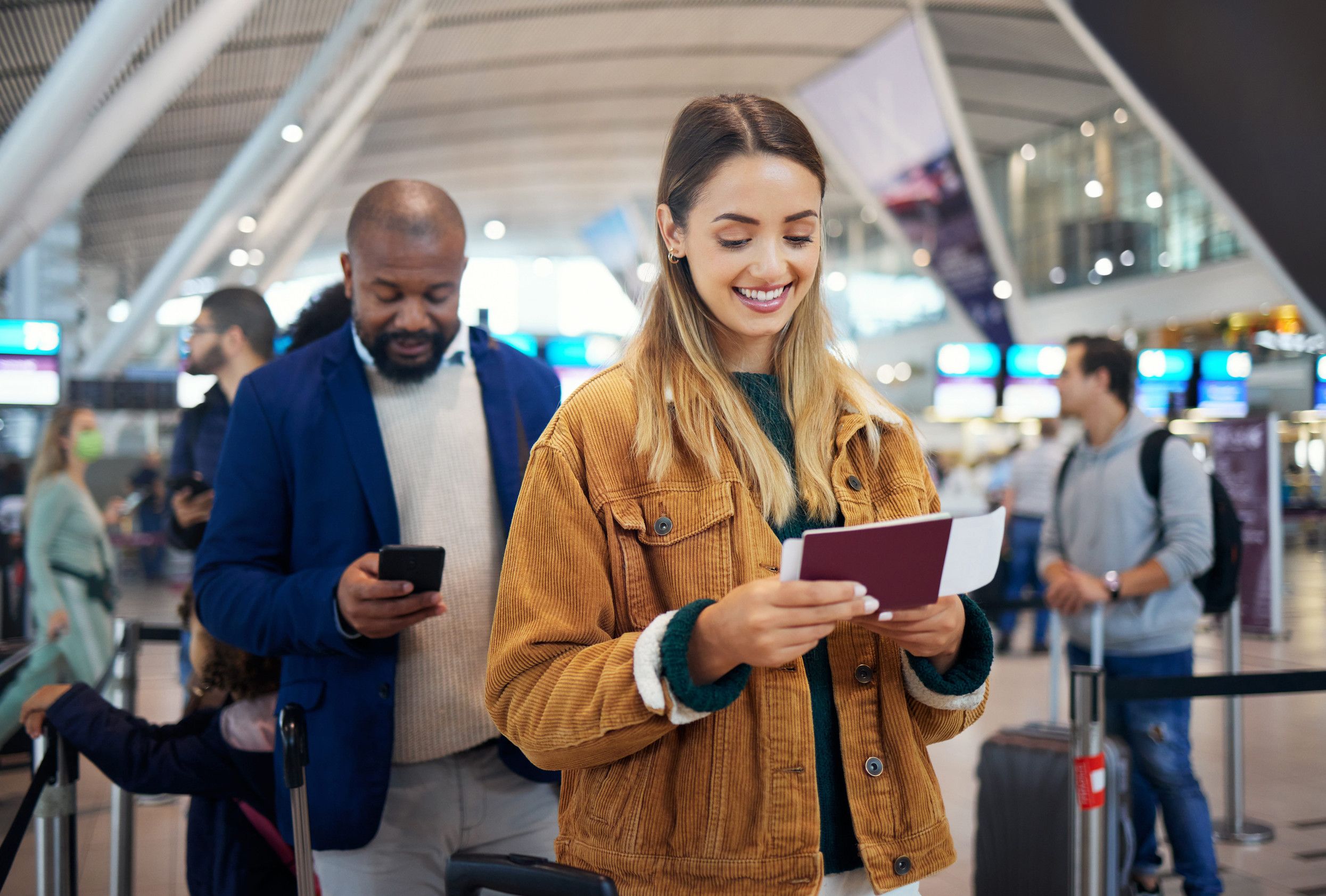 Woman with passport at airport lobby